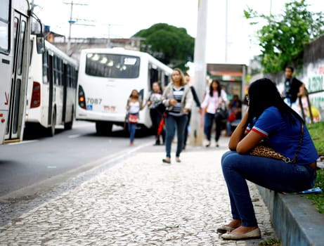 salvador, bahia / brazil - august 7, 2014: people are seen at public transport bus stop in the city of Salvador.