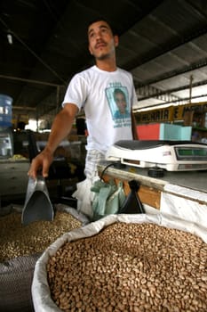 itabuna, bahia, / brazil - november 26, 2011: marketer is seen selling beans at a fair in the city of Itabuna, in southern Bahia..