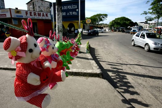 itabuna, bahia / brazil - december 20, 2011: stuffed animals are seen for sale on a clothesline mounted on a street in the city of Itabuna, in southern Bahia.
