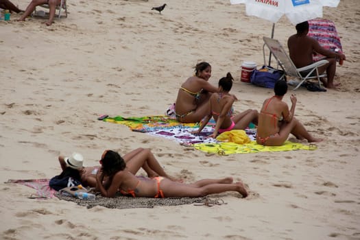 salvador, bahia / brazil - november 23, 2014: women are seen at Barra beach in the city of Salvador.