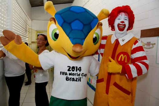 salvador, bahia / brazil - may 24, 2013: Ronald McDonald's and Fuleco, mascot of the Fifa World Cup, 2014 in Brazil, are seen in a public school in the city of Salvador.