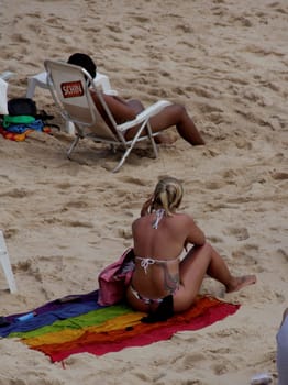 salvador, bahia / brazil - november 23, 2014: women are seen at Barra beach in the city of Salvador.