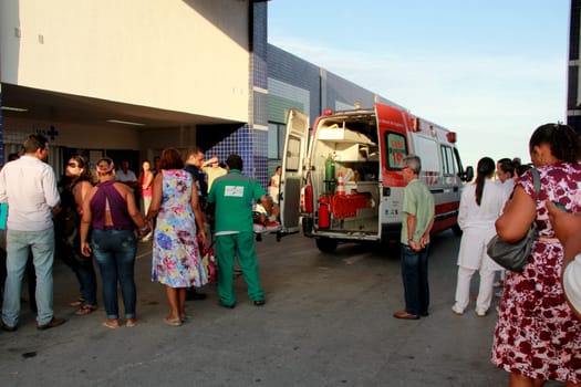 salvador, bahia / brazil - november 28, 2012: people are seen next to an ambulance of Samu 192, near the emergency of Hospital Roberto Santos in the city of Salvador.