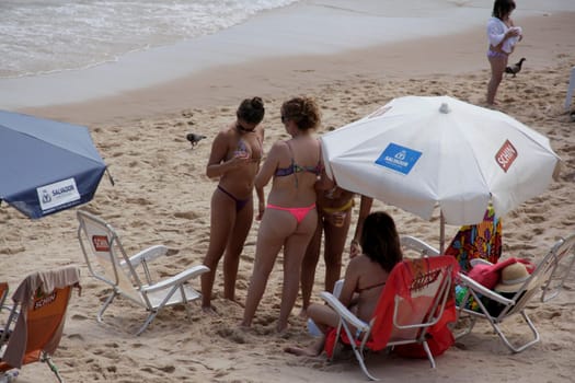 salvador, bahia / brazil - november 23, 2014: women are seen at Barra beach in the city of Salvador.