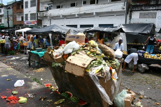 itabuna, bahia / brazil - november 27, 2011: Food is thrown in the trash at a free fair in the citu of Itabuna.