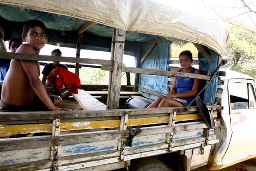 arataca, bahia / brazil - september 30, 2011: public school students being transported on arara stick - truck body - in the city of Arataca, in southern Bahia.
