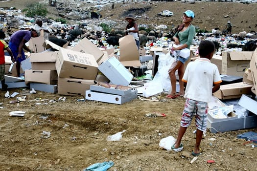 Itabuna, bahia / brazil - september 27, 2011: people are seen turning through the garbage to collect recycling material at the sanitary landfill in the city of Itabuna......