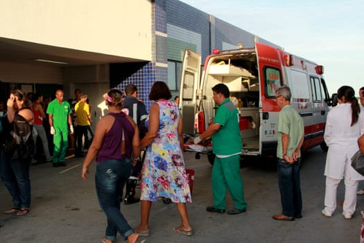 salvador, bahia / brazil - november 28, 2012: people are seen next to an ambulance of Samu 192, near the emergency of Hospital Roberto Santos in the city of Salvador.