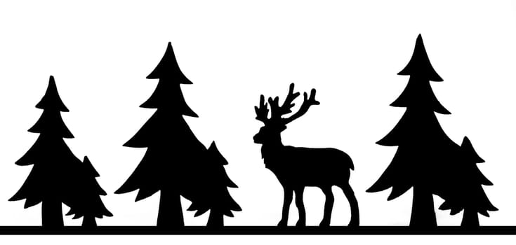 Cut out deer figure made of wood with dark edges and wooden fir trees isolated on white