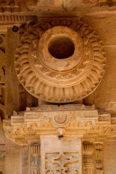 Details of beautifully carved stone water pot on top of pillar at Gwalior Fort in Gwalior in Madhya Pradesh, India, Asia
