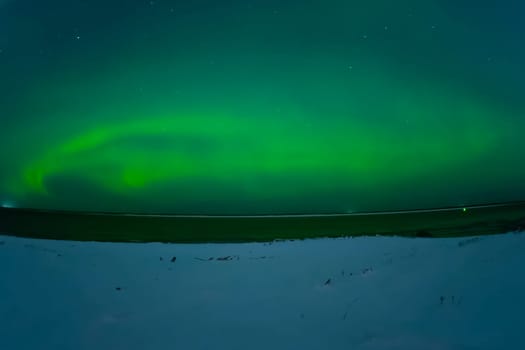 Northern Lights in the night sky. Northern Lights in the tundra.