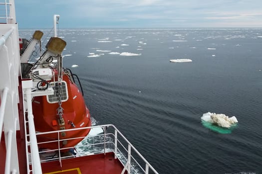 The feed of a ship sailing in the Arctic. Landscape of the Arctic from the deck of the tanker.