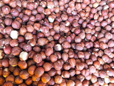 Close-Up Of Peeled Hazelnuts. Healthy Fresh Food Background.