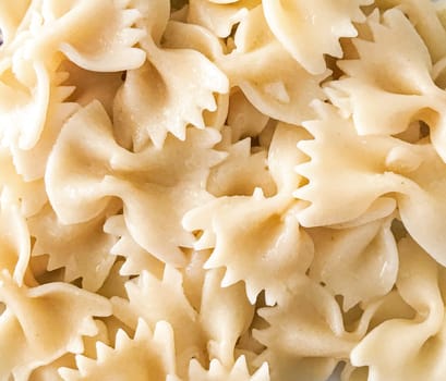Close up of farfalle pasta background. Farfalle are a type of pasta/noodle commonly known as bow-tie pasta or butterfly pasta.