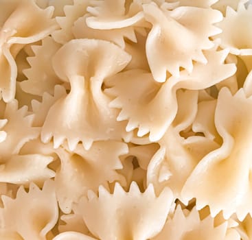 Close up of farfalle pasta background. Farfalle are a type of pasta/noodle commonly known as bow-tie pasta or butterfly pasta.
