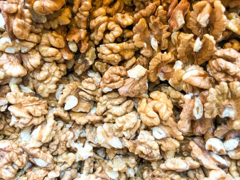 Close-Up Of Peeled Walnuts. Healthy Fresh Food Background.