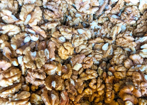 Close-Up Of Peeled Walnuts. Healthy Fresh Food Background.