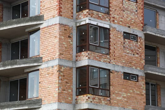 Newly built building in a residential complex. New construction site