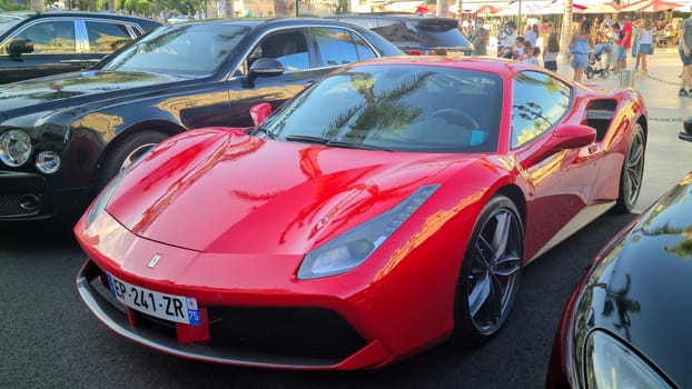 Monte-Carlo, Monaco - August 17, 2020: Red Ferrari 488 GTB Supercar Parked On The Casino Square In Monte-Carlo, Monaco, Europe. Close Up View .