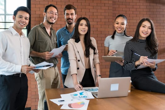 Portrait of a smiling group of diverse interracial corporate colleagues in meeting room for startup new business. Business coporate brainstorming concept for new startup team.