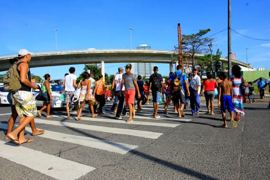 salvador, bahia / brazil - december 5, 2013: people are seen crossing the street in a pedestrian lane in the city of Salvador.