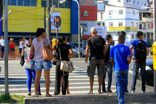 salvador, bahia / brazil - december 5, 2013: people are seen crossing the street in a pedestrian lane in the city of Salvador.