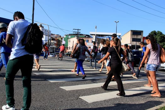 salvador, bahia / brazil - december 5, 2013: people are seen crossing the street in a pedestrian lane in the city of Salvador.