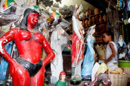 salvador, bahia / brazil - april 21, 2013: article religios for members of the Candomble religion are seen for sale at the Sao Joaquim fair in the city of Salvador.