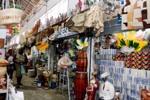 salvador, bahia / brazil - april 21, 2013: article religios for members of the Candomble religion are seen for sale at the Sao Joaquim fair in the city of Salvador.