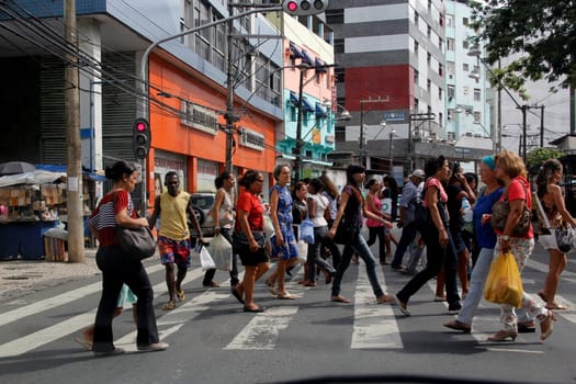 salvador, bahia / brazil - january 23, 2013: people are seen crossing the street in a pedestrian lane in downtown Salvador..