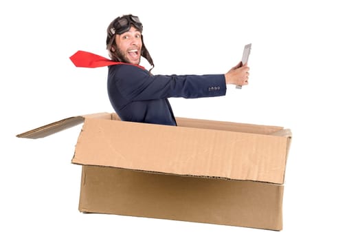 Businessman with tablet flying a carboard box isolated in white