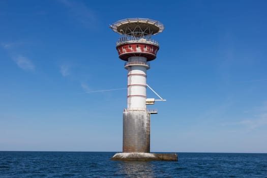 Irbe lighthouse in Baltic sea. Built in 1979 in Mihaila Michaels bank, claimed by Soviet media as the largest nuclear-powered lighthouse in USSR. Formerly inhabited, has a helicopter platform on the top, nowadays it is powered by solar energy.
