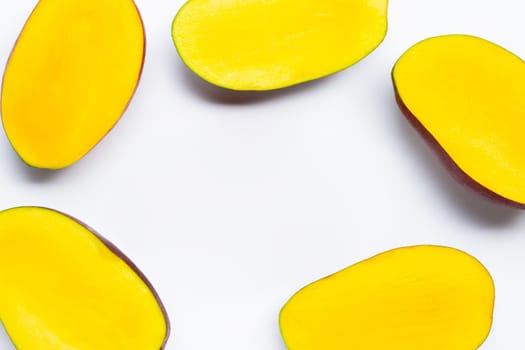 Tropical fruit, Frame made of mango slices on white background. Top view
