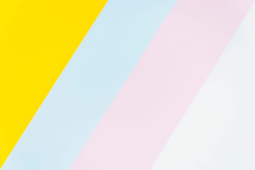 Minimalist abstract background featuring diagonal stripes in yellow, blue, pink, and white. Modern and soft color composition, ideal for design, branding, or artistic projects