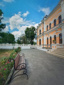 The yard with garden and benches in front of the Manuc Bei mansion. Manuc Bey manor, architectural, culture, historic complex with museum, winery and other edifices located in Hincesti city, Moldova.