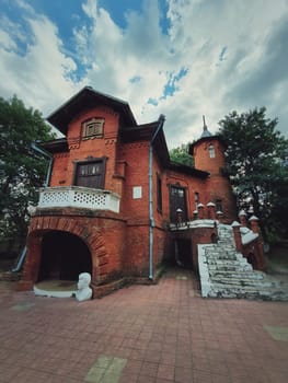The Hunting Castle facade, Manuc Bei mansion, architectural, culture and historic complex of Hincesti city, Moldova. Ancient brick building. Halloween haunted house theme concept, ghost home or manor.