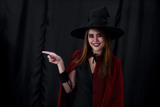 Portrait of asian young adult teenage woman wear Halloween costume cloth for Halloween party carnival. Halloween celebrate and international holiday concept.