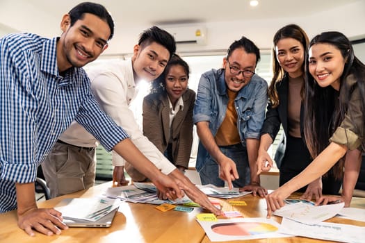 Interracial asian business team brainstorming idea talk and discuss at office meeting room after reopen due to coronavirus COVID-19 city lockdown. Business startup meeting and brainstorm concept.