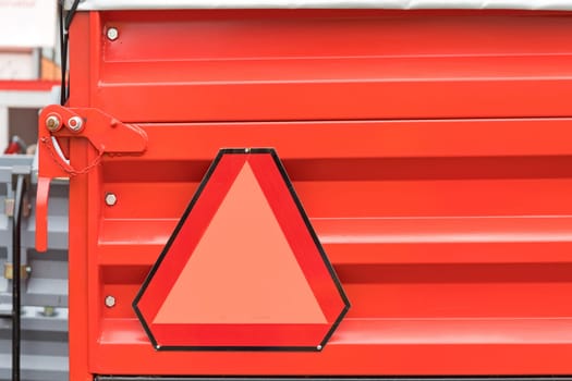 Red Safety Triangle at Agriculture Trailer