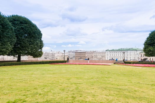 Green meadow in St. Petersburg. City park on the Neva river
