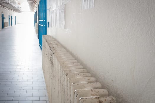 Radiator in an old prison. Metaphor of Heat in a cool place.
