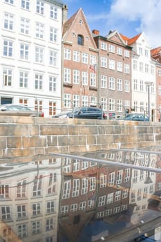 Colored Danish Homes with reflection. View from a Boat