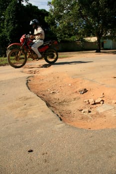 eunapolis, bahia / brazil - april 8, 2009: holes are seen on highway BA 280, a road that connects the municipalities of Itabela to Guaratinga in southern Bahia..