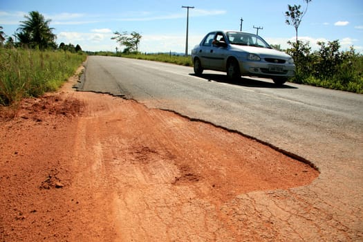 eunapolis, bahia / brazil - april 8, 2009: holes are seen on highway BA 280, a road that connects the municipalities of Itabela to Guaratinga in southern Bahia..