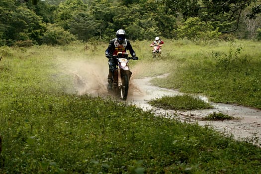 porto seguro, bahia / brazil - april 12, 2009: motorcyclist during motocross enduro in the city of Porto Seguro, in southern Bahia...