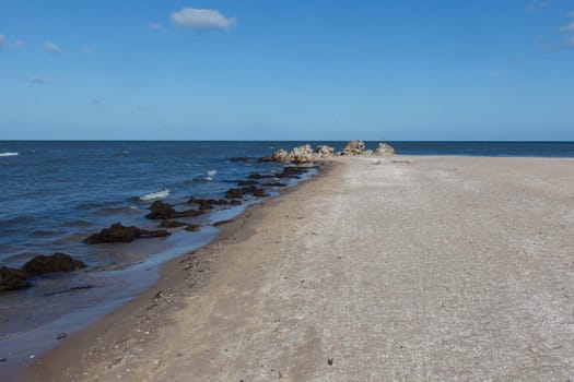 Cape Kolka - the meeting place of the Baltic sea and the Gulf of Riga, Latvia. Ruins of old lighthouse at the top of cape.