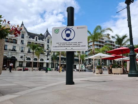 Monte-Carlo, Monaco - September 9, 2020: Protective Face Mask Required Sign On The Casino Square In Monte-Carlo, Monaco, Europe. Close Up View