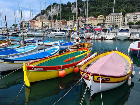 Nice, France - August 18, 2020: Small Colorful Wooden Fishing Boats Moored In The Old Port Of Nice, French Riviera, France, Europe