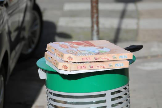 Nice, France - January 29, 2019: Empty Pizza Boxes On A Trash Can In The Street In Nice On The French Riviera, France, Europe