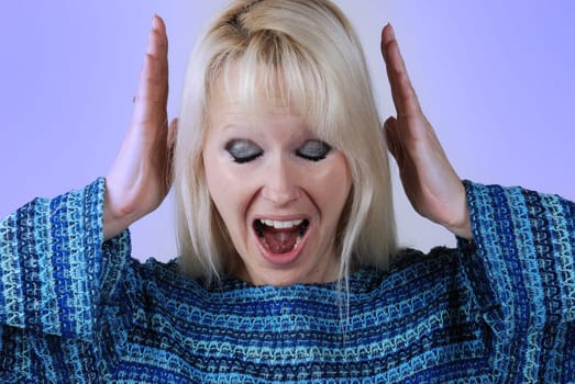 Young blonde woman with a cry